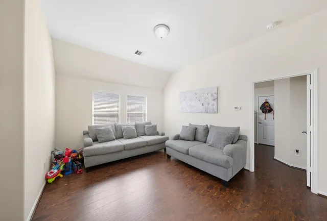 a living room with furniture and a couch