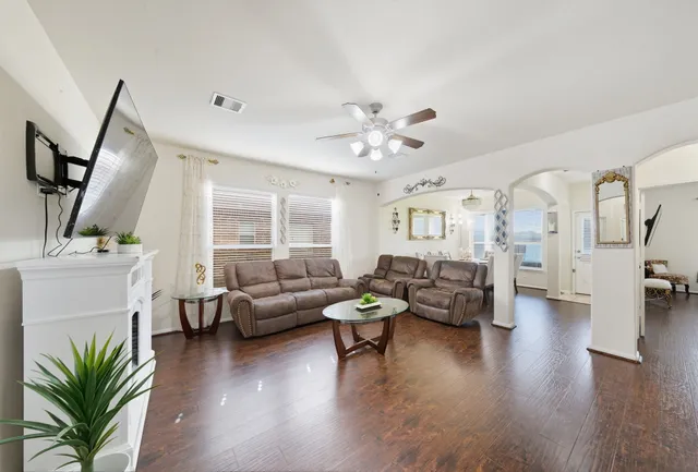 a living room with furniture and a large window