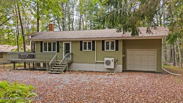 a backyard of a house with barbeque oven table and chairs
