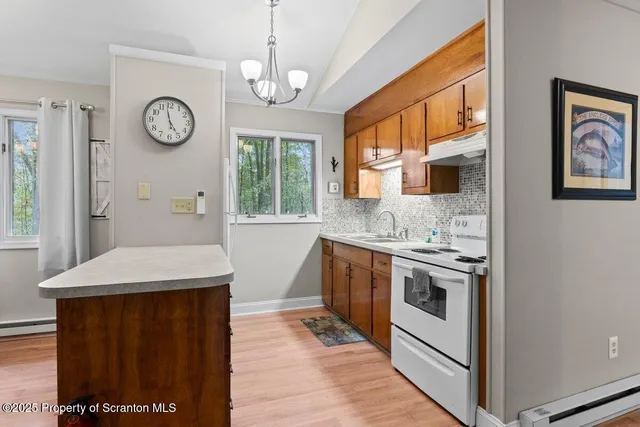 a bathroom with a toilet a sink and a shower