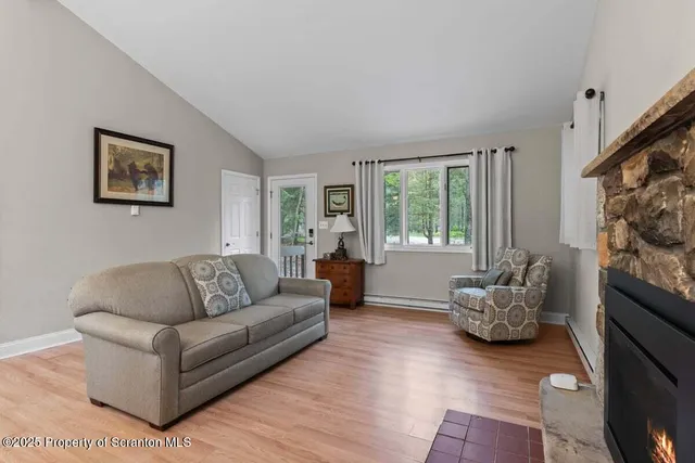 a kitchen with stainless steel appliances a stove a sink and a microwave