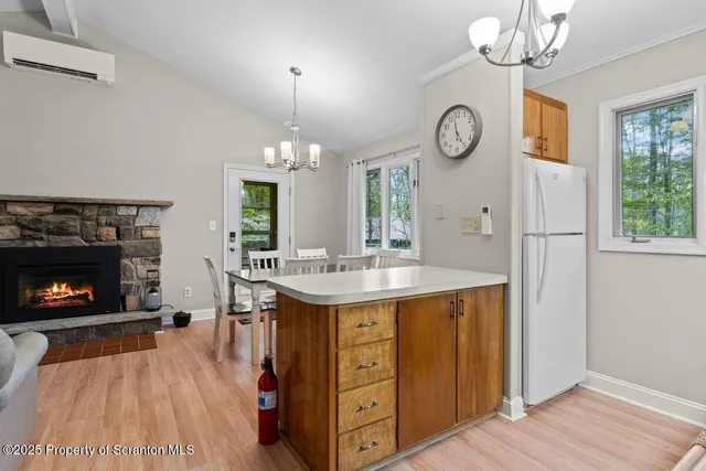 a view of a house with a window and wooden fence