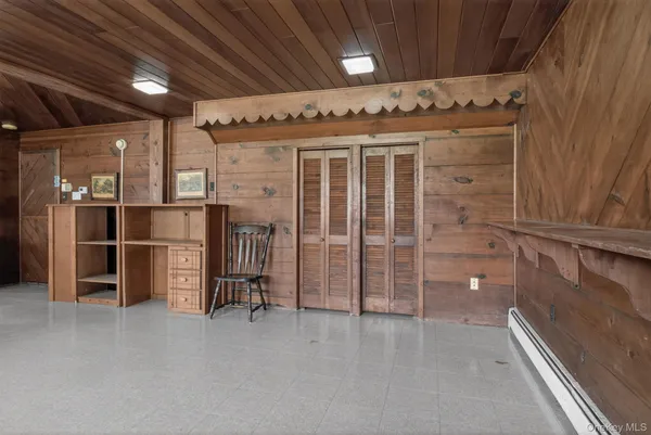 a view of an empty room with a fireplace