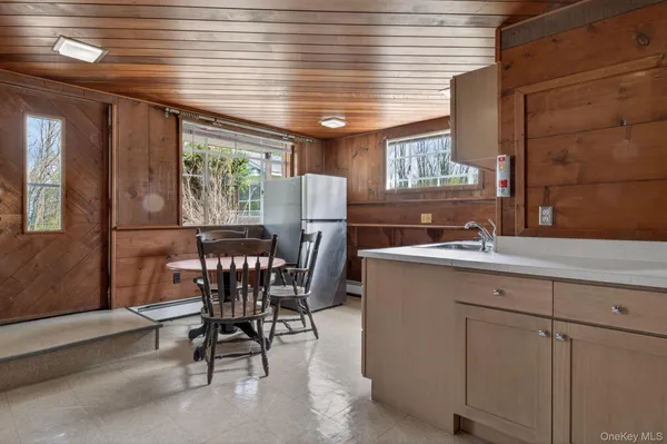 a view of a dining room with furniture window and outside view
