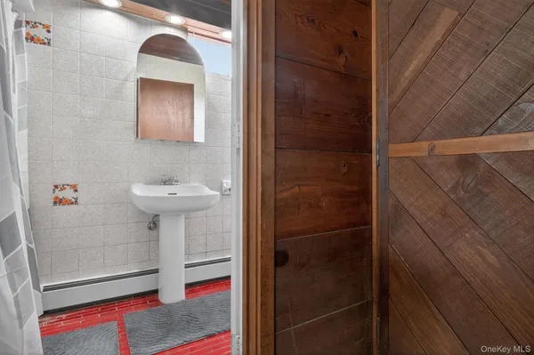 a bathroom with a sink and mirror