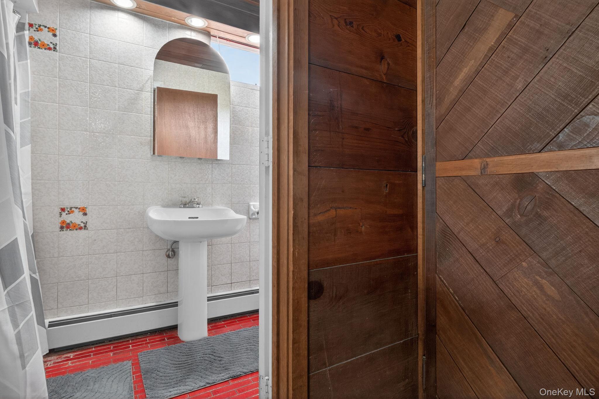 353 Candlestick Hill Road Newburgh, NY 12550 - Photo 9 of 19 a bathroom with a sink and mirror