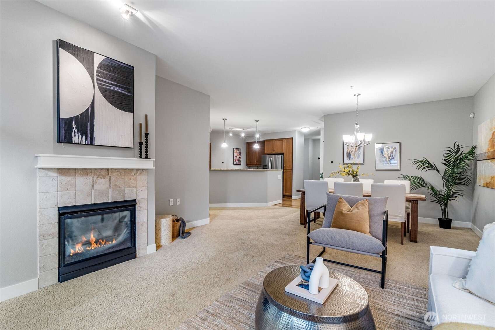 15700 116th Avenue Northeast, Unit 102A Bothell, WA 98011 - Photo 4 of 35 a living room with furniture and a fireplace