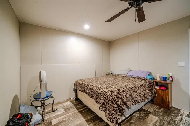 a bedroom with a bed and cabinets