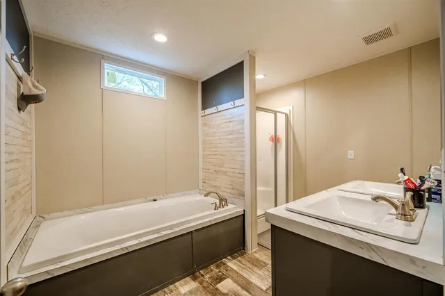 a bathroom with a bathtub and a sink
