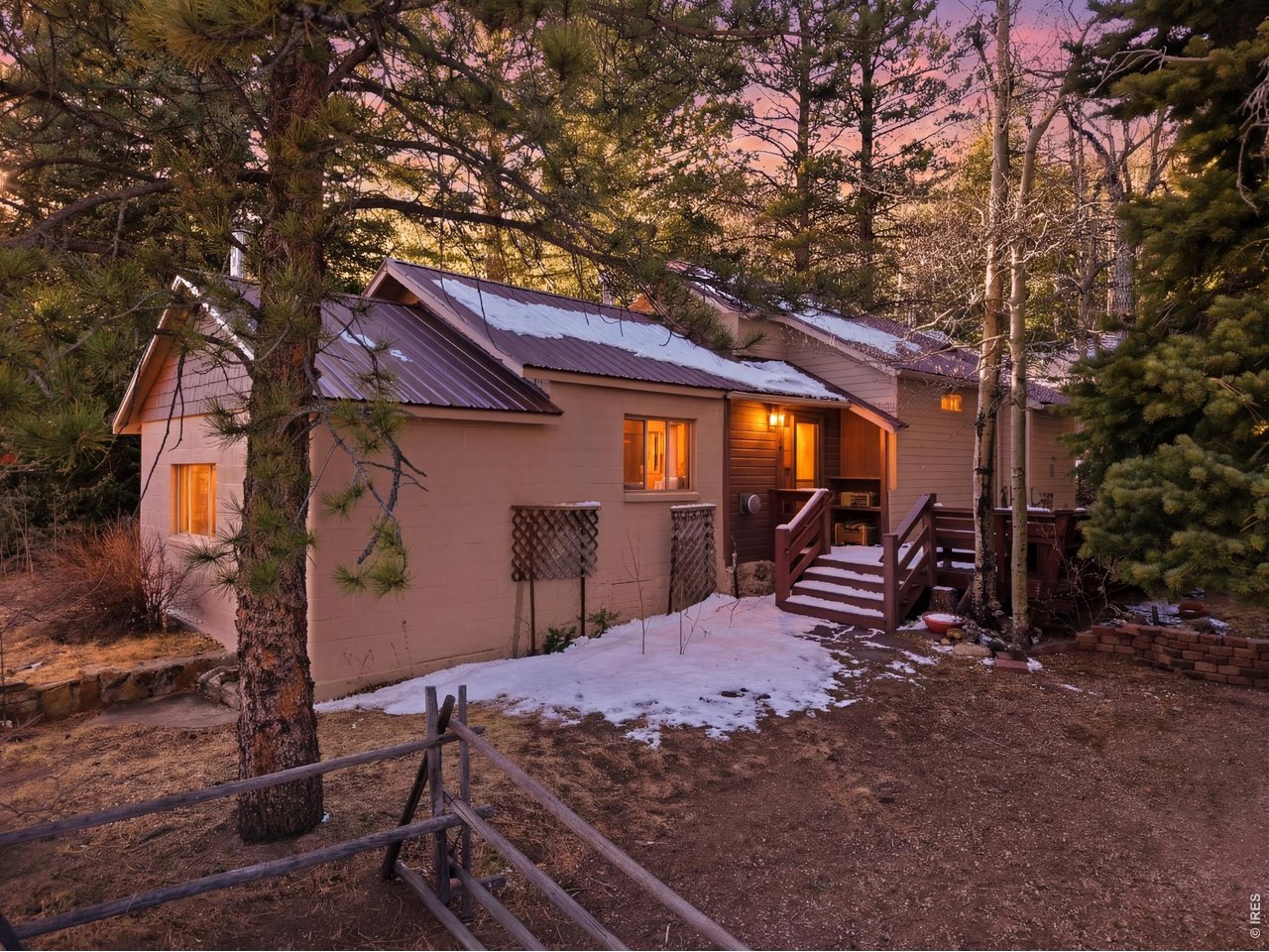 2476 Riverside Drive Lyons, CO 80540 - Photo 2 of 42 a view of a backyard with a large tree