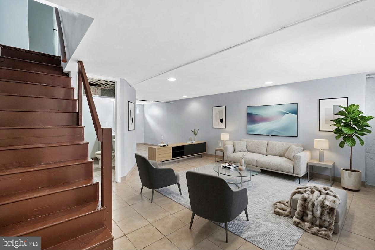 3522 Meridian Street Philadelphia, PA 19136 - Photo 13 of 18 a living room with furniture and a potted plant