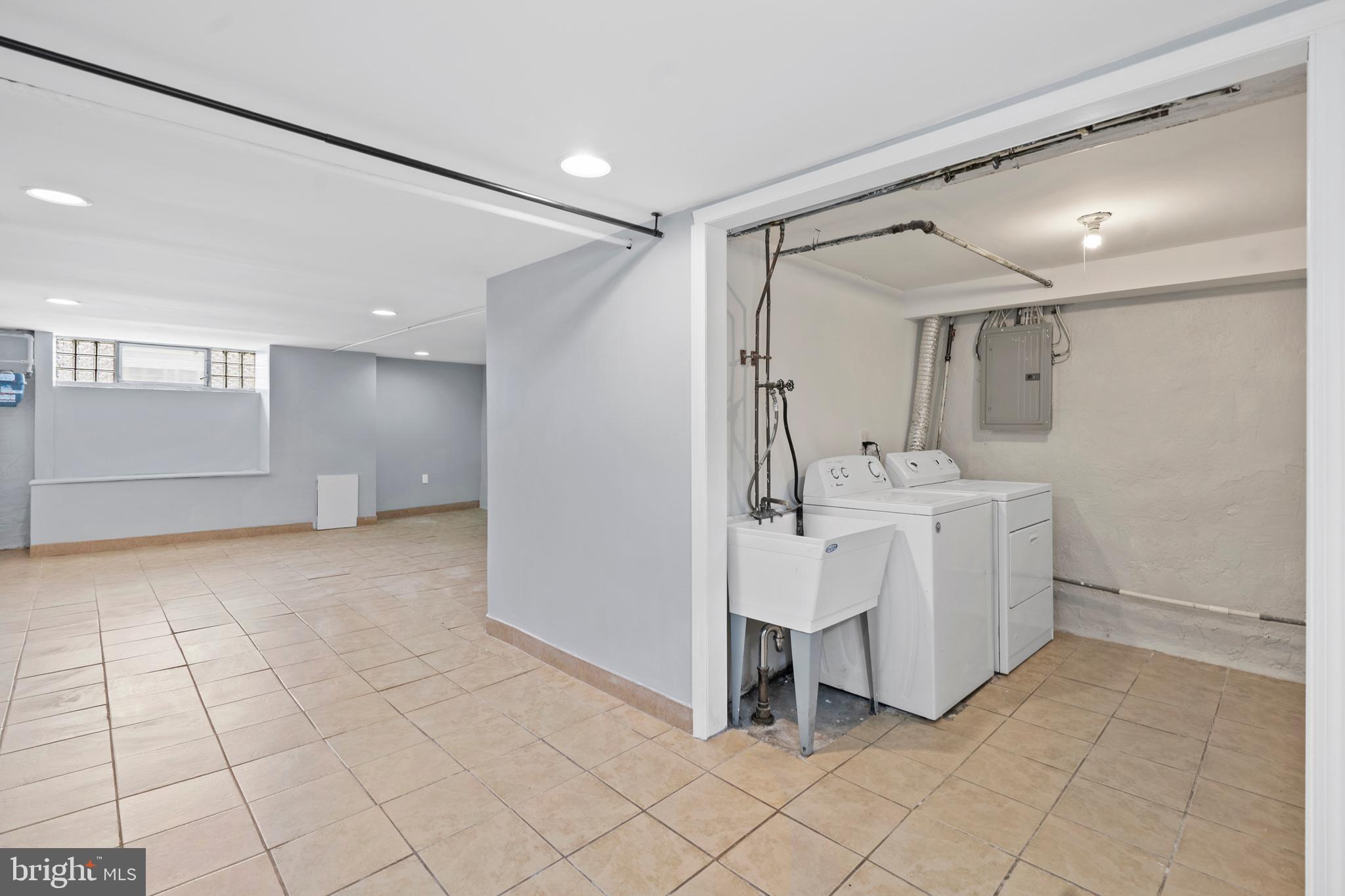 3522 Meridian Street Philadelphia, PA 19136 - Photo 15 of 18 a bathroom with a sink mirror and shower