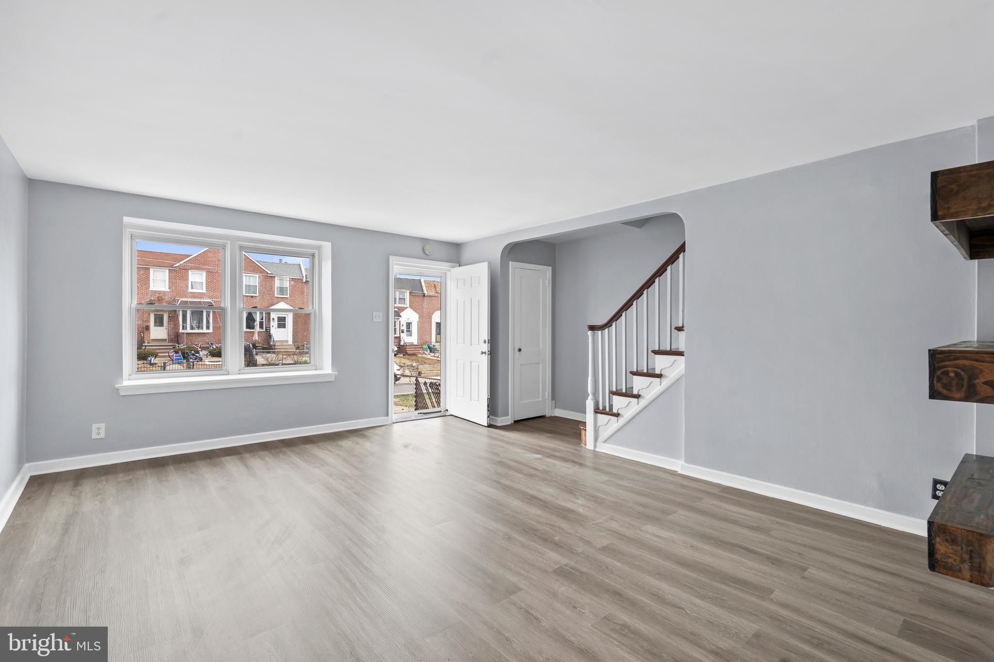 3522 Meridian Street Philadelphia, PA 19136 - Photo 4 of 18 a view of an empty room with wooden floor and a window