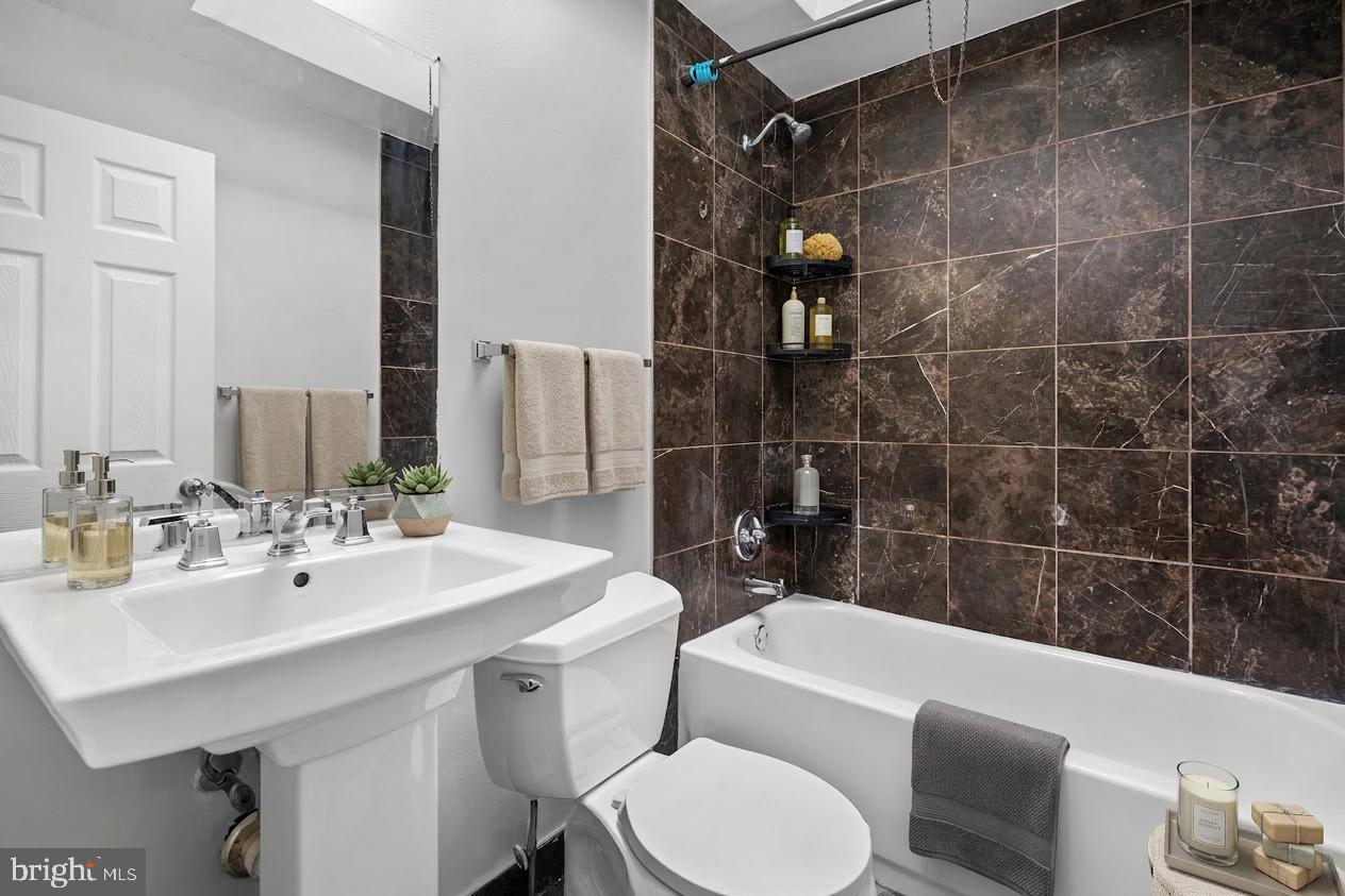 3522 Meridian Street Philadelphia, PA 19136 - Photo 8 of 18 a bathroom with a sink mirror toilet and bathtub