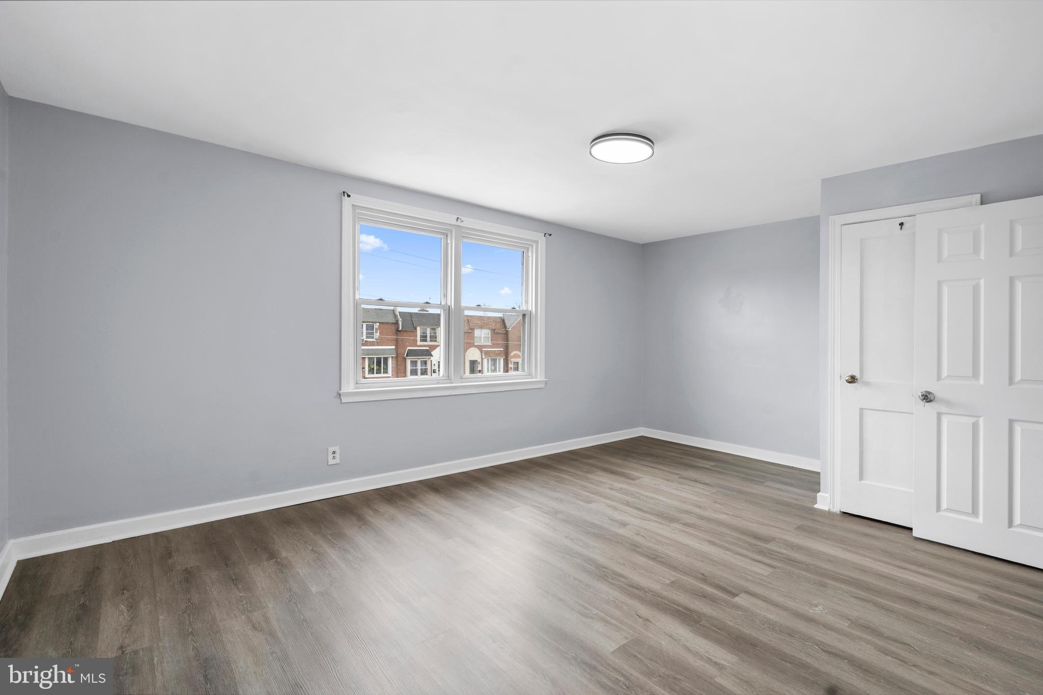 3522 Meridian Street Philadelphia, PA 19136 - Photo 9 of 18 an empty room with wooden floor and windows