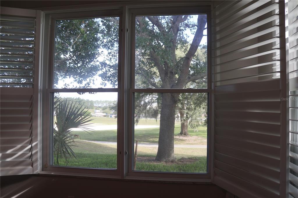3850 Beacon Ridge Way Clermont, FL 34711 - Photo 35 of 41 a view of a glass door with a yard from a window