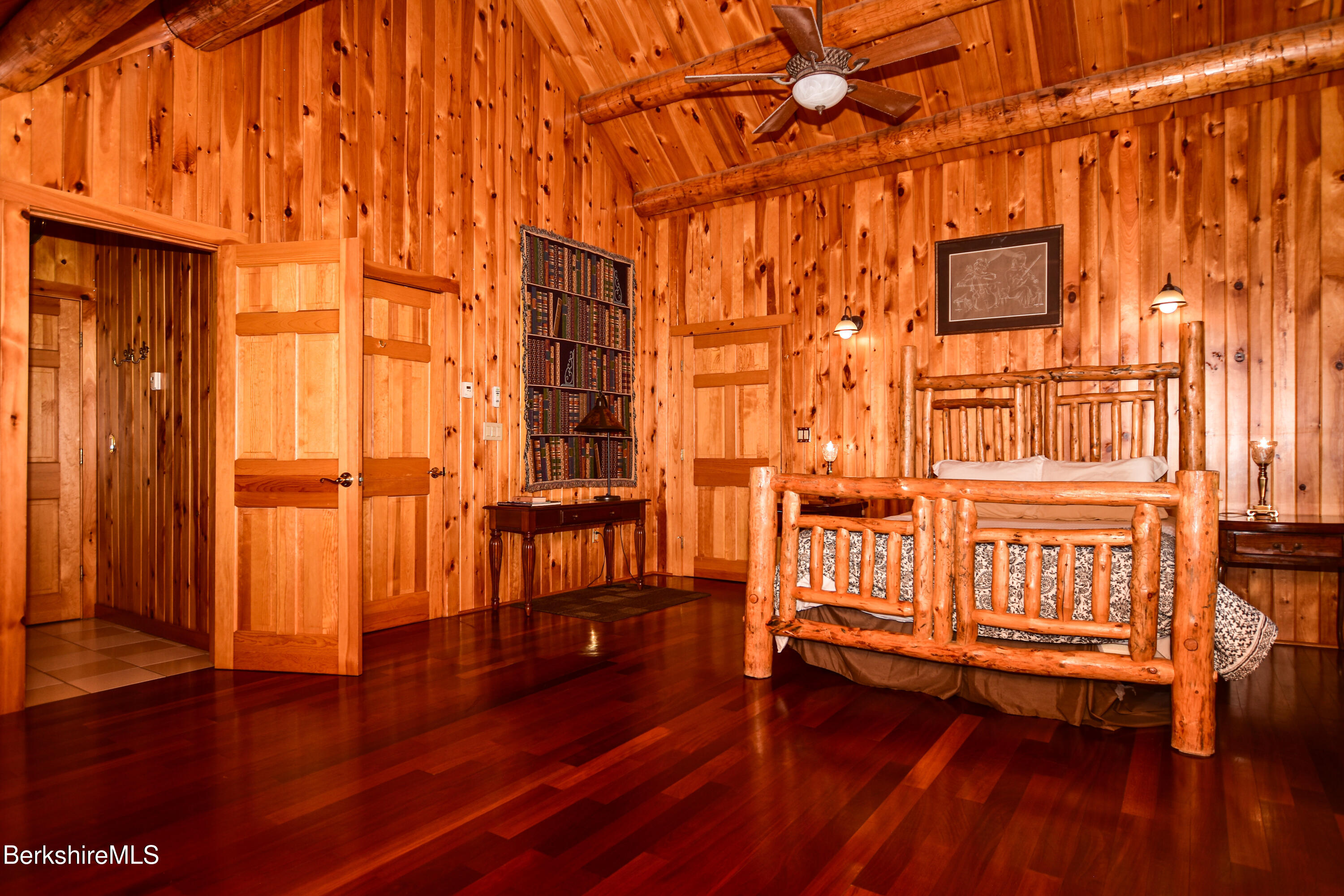 233 Algerie Road Becket, MA 01223 - Photo 30 of 48 wooden floor with windows and brick walls