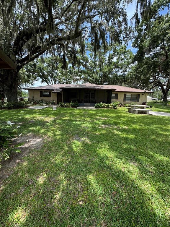 4106 Old Mulberry Road Plant City, FL 33567 - Photo 12 of 52 a front view of a house with a garden