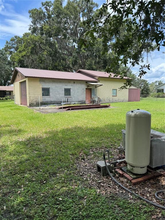 4106 Old Mulberry Road Plant City, FL 33567 - Photo 14 of 52 a view of a backyard with a garden and fire pit