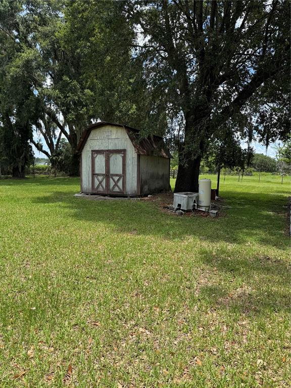 4106 Old Mulberry Road Plant City, FL 33567 - Photo 17 of 52 a view of a house with a yard