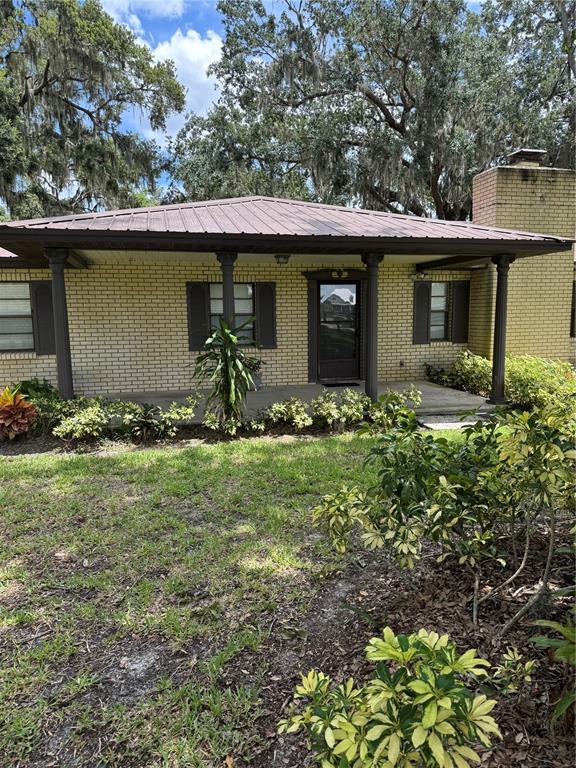 4106 Old Mulberry Road Plant City, FL 33567 - Photo 2 of 52 a front view of a house with garden