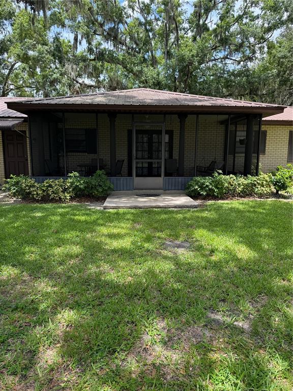 4106 Old Mulberry Road Plant City, FL 33567 - Photo 24 of 52 a front view of a house with a yard and garage