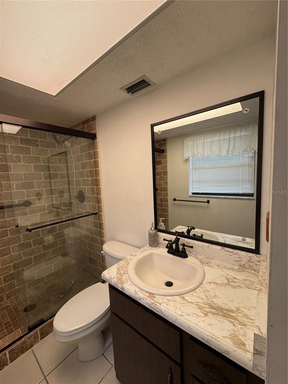 4106 Old Mulberry Road Plant City, FL 33567 - Photo 29 of 52 a bathroom with a granite countertop sink toilet and shower