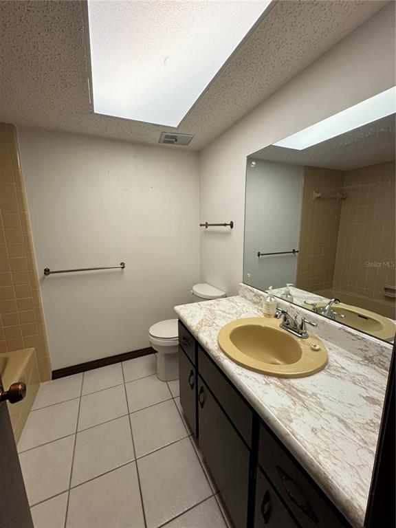 4106 Old Mulberry Road Plant City, FL 33567 - Photo 40 of 52 a bathroom with a granite countertop sink a toilet a mirror and vanity