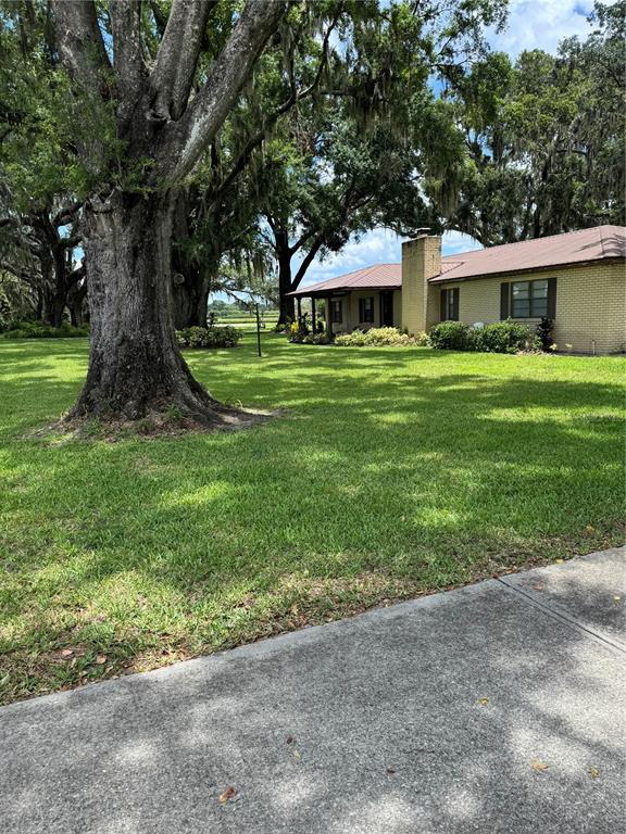 4106 Old Mulberry Road Plant City, FL 33567 - Photo 5 of 52 a view of house with outdoor space and garden