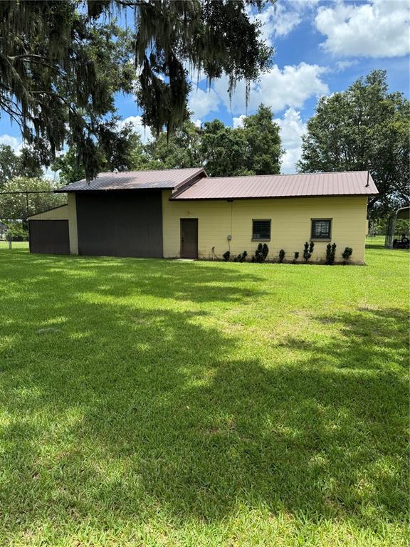 4106 Old Mulberry Road Plant City, FL 33567 - Photo 7 of 52 a front view of a house with a yard and garage