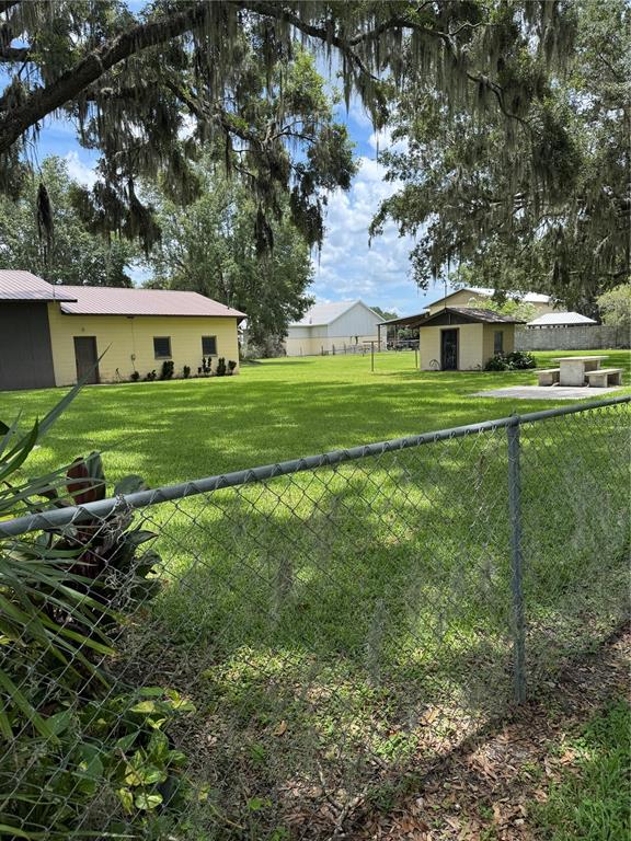 4106 Old Mulberry Road Plant City, FL 33567 - Photo 9 of 52 a front view of a house with a yard