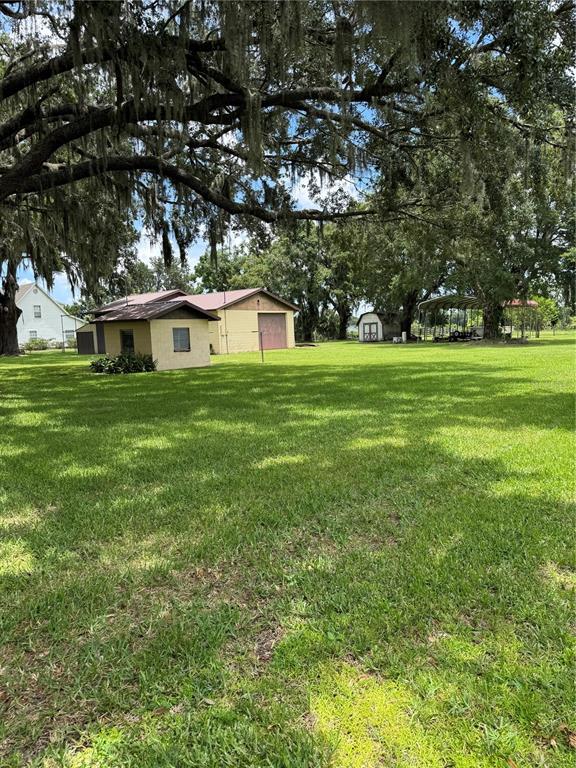 4106 Old Mulberry Road Plant City, FL 33567 - Photo 10 of 52 a front view of a house with a garden