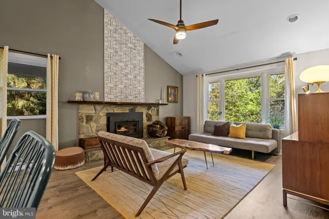 a living room with furniture and a fireplace