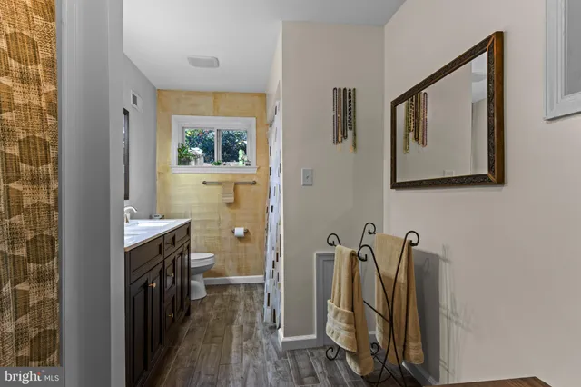 a view of a bathroom with sink washer and dryer