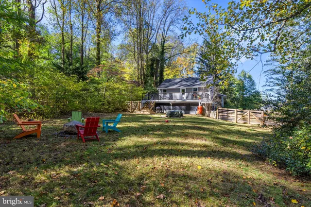 a front view of a house with swimming pool garden and patio