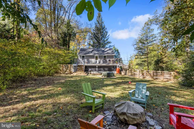 a front view of a house with a yard table and chairs