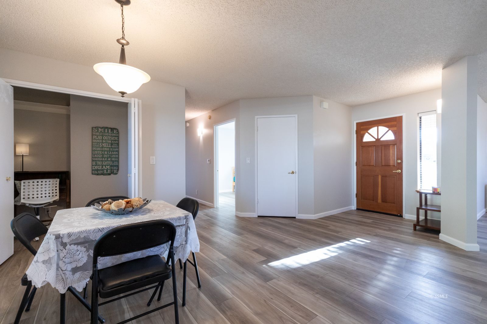 616 Yellow Astor Avenue Ridgecrest, CA 93555 - Photo 4 of 29 a view of a dining room with furniture and wooden floor