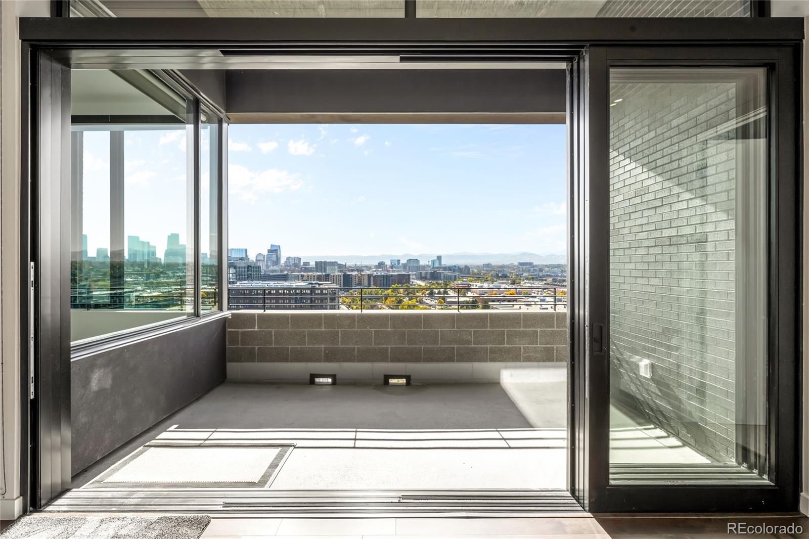 3520 Chestnut Place, Unit PH1207 Denver, CO 80216 - Photo 11 of 37 a view of a living room and window