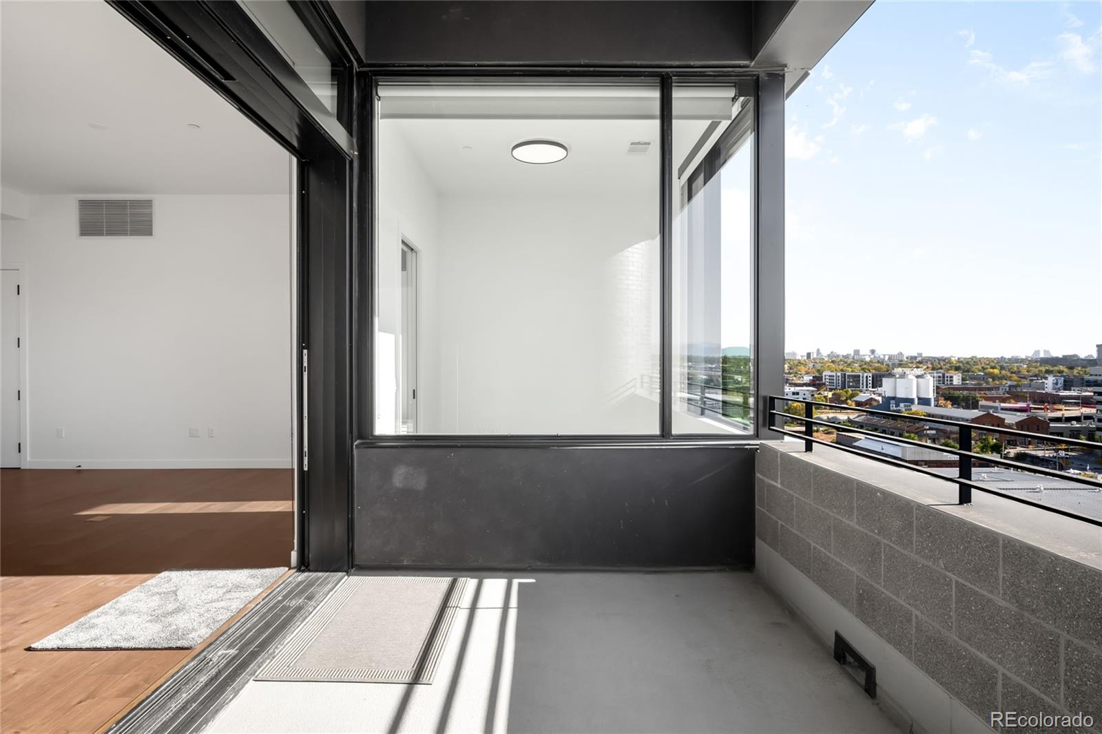 3520 Chestnut Place, Unit PH1207 Denver, CO 80216 - Photo 12 of 37 a view of balcony and living room