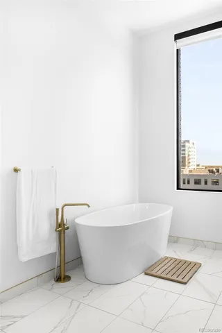 a view of walk in closet with cabinet