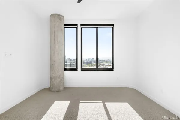 a view of a bedroom with sink and closet