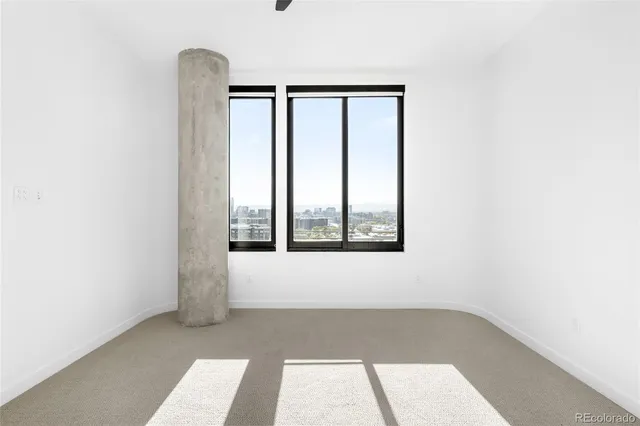 a view of a bedroom with sink and closet