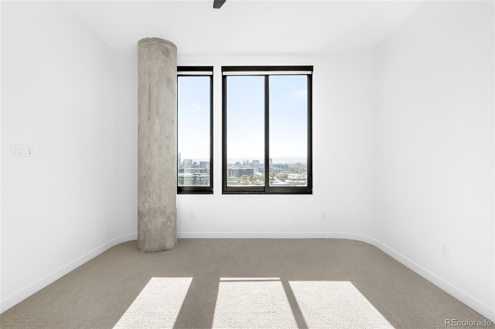 3520 Chestnut Place, Unit PH1207 Denver, CO 80216 - Photo 23 of 37 an empty room with window