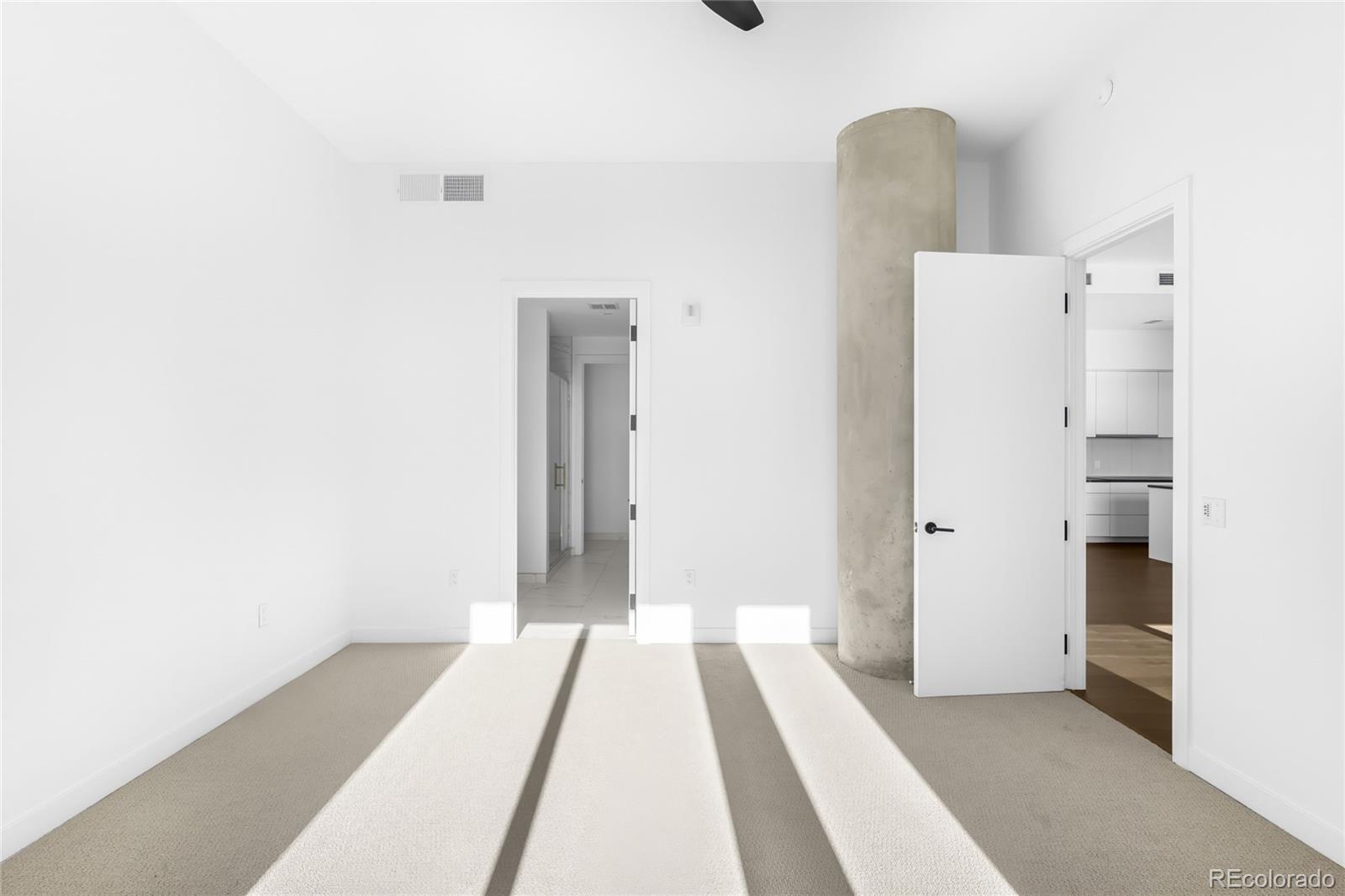 3520 Chestnut Place, Unit PH1207 Denver, CO 80216 - Photo 24 of 37 a view of a bedroom with sink and closet