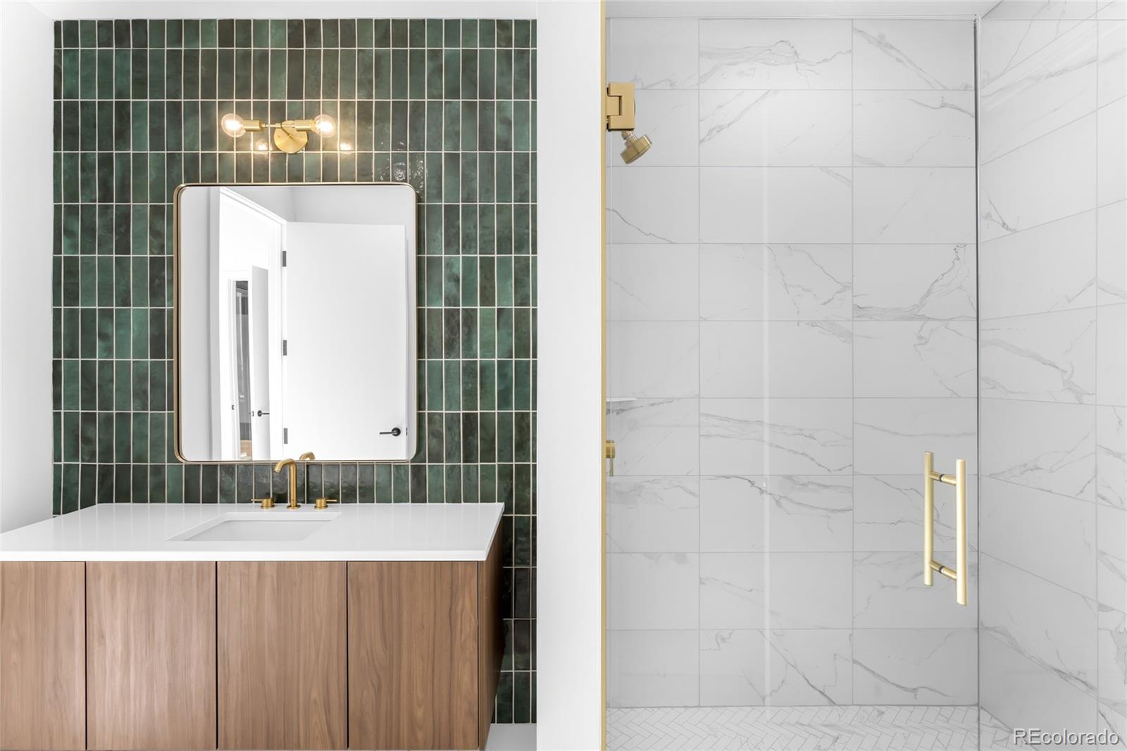 3520 Chestnut Place, Unit PH1207 Denver, CO 80216 - Photo 25 of 37 a bathroom with a granite countertop sink and a mirror