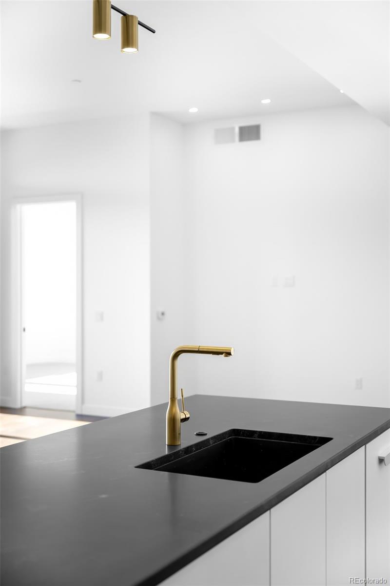 3520 Chestnut Place, Unit PH1207 Denver, CO 80216 - Photo 9 of 37 a view of a sink