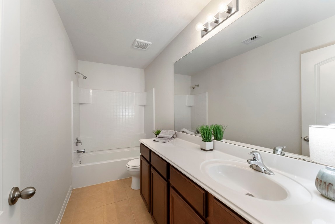 9159 Nina Road Conroe, TX 77304 - Photo 12 of 24 Next to the office is the secondary bathroom with tons of counter space.