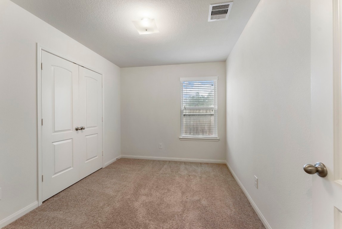 9159 Nina Road Conroe, TX 77304 - Photo 13 of 24 Secondary bedroom with roomy closet
