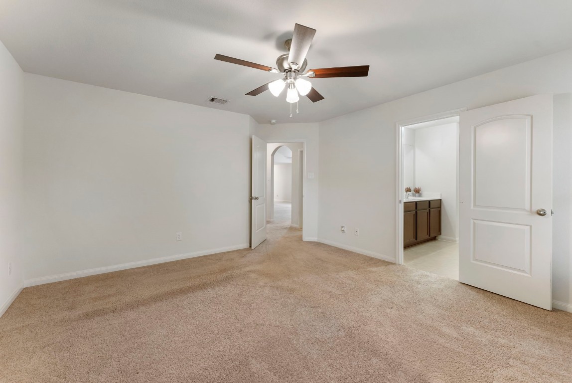 9159 Nina Road Conroe, TX 77304 - Photo 20 of 24 Primary Suite with new ceiling fan.