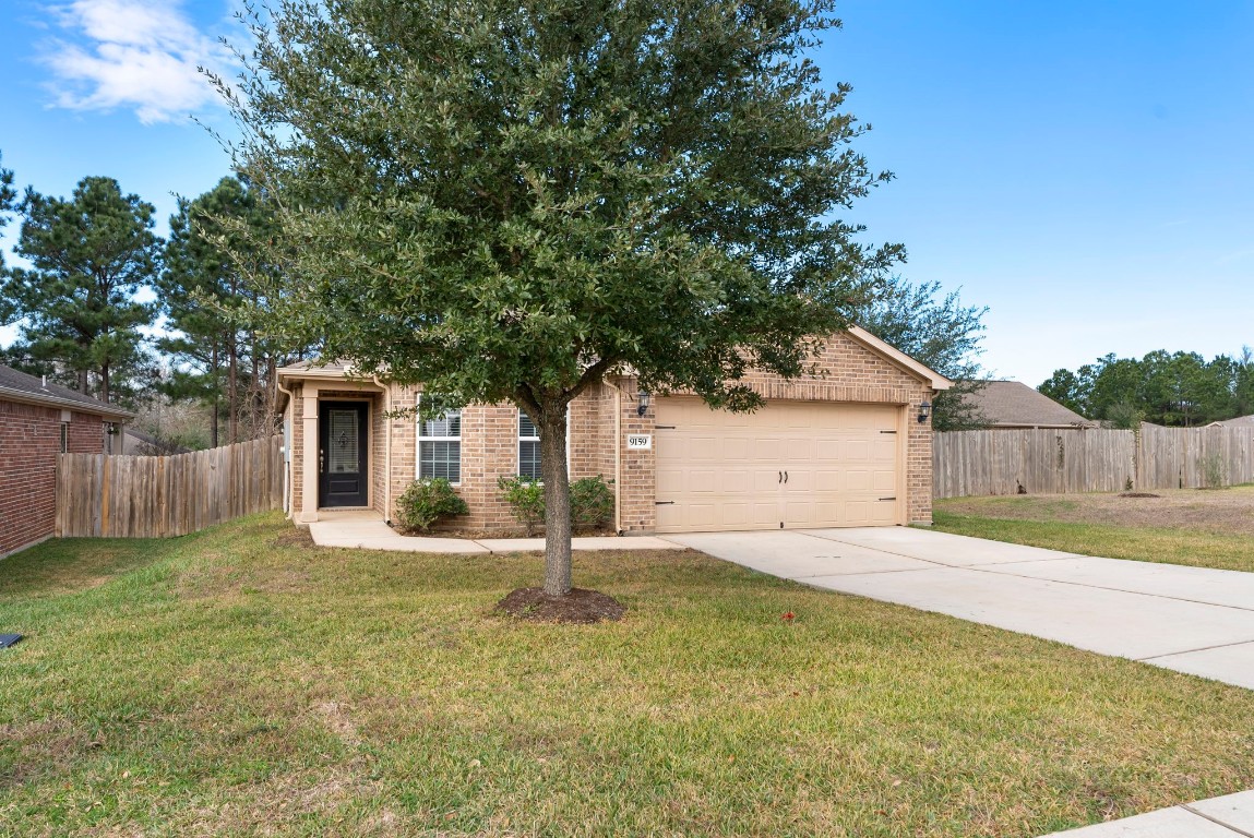 9159 Nina Road Conroe, TX 77304 - Photo 24 of 24 Wow, look at how the clean the driveway and sidewalks are.